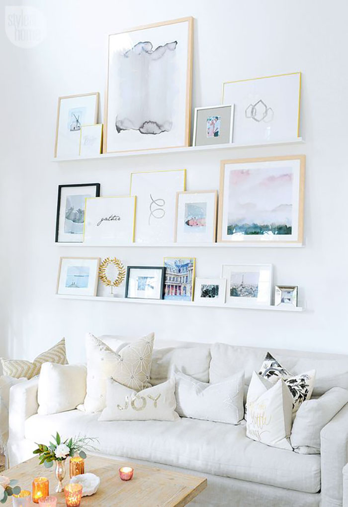 3 white shelves are used, tasteful light colored interior.