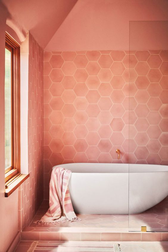 This is very coral, but the hexagonal tiles and the white bathtub makes it softer.