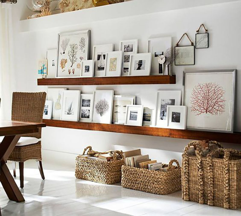 Frames are placed on shelves, light colors are used which look amazing with the wooden shelves.